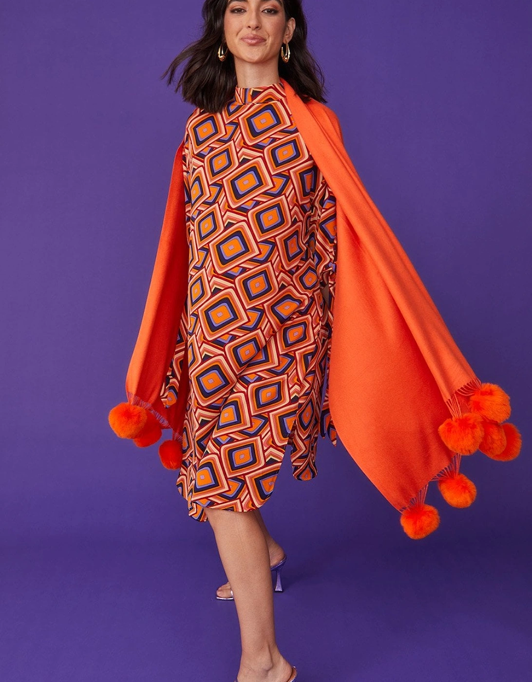 Cashmere blend wrap with love heart poms in Orange