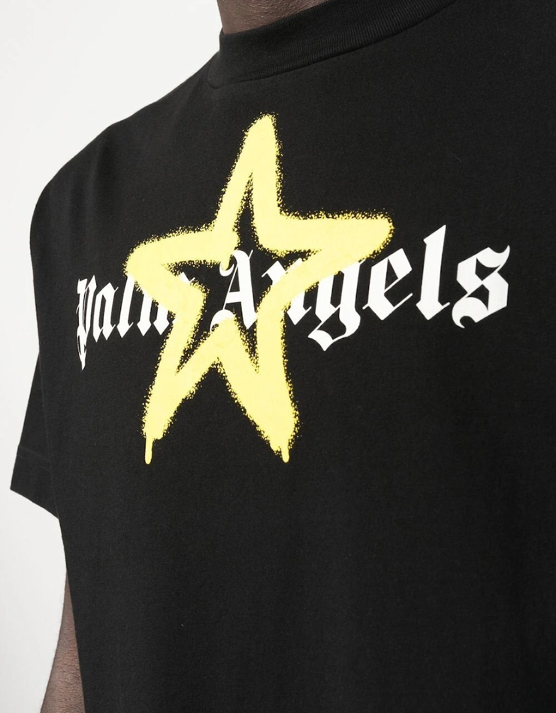 Yellow Star Sprayed logo-print T-shirt in Black