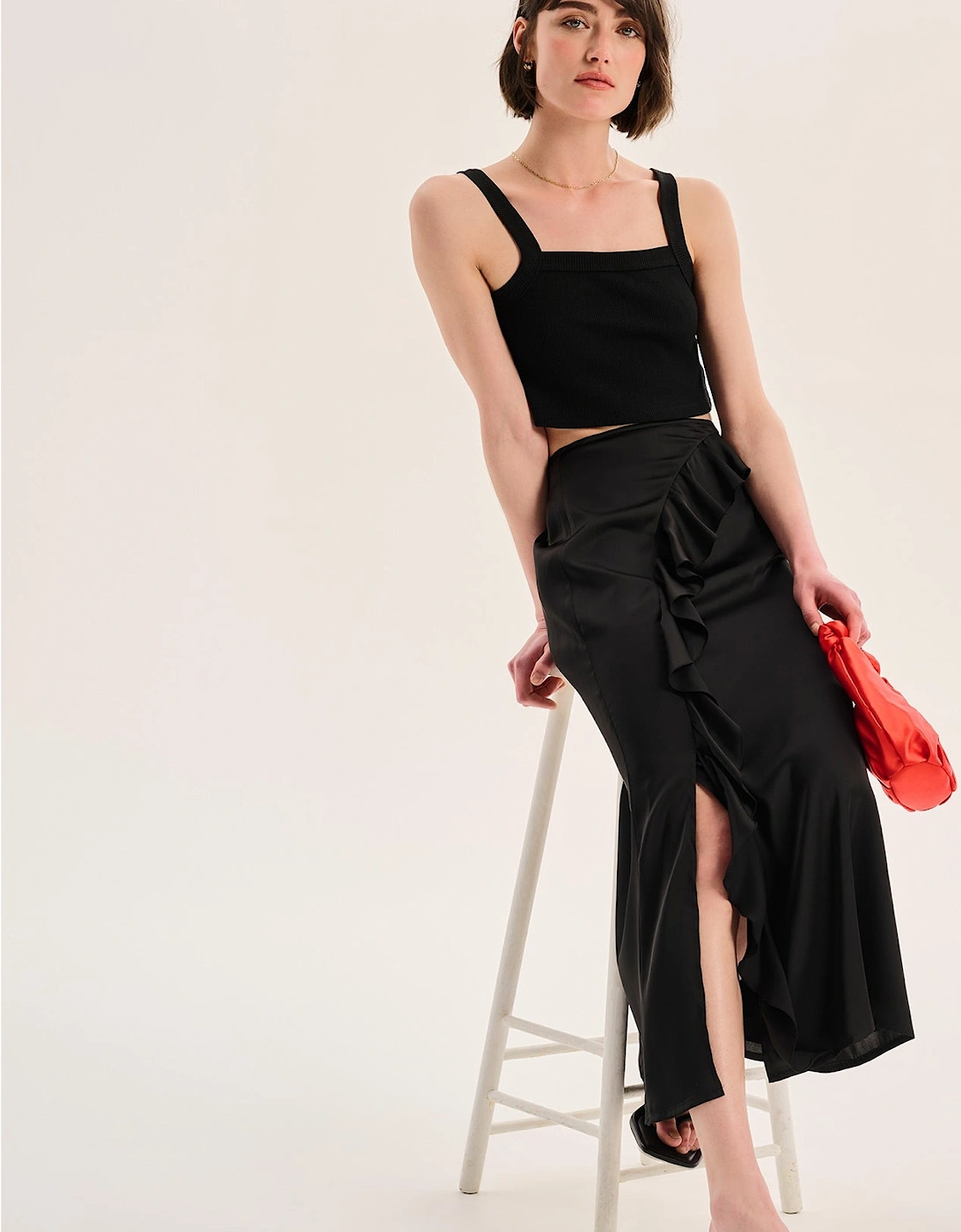 Udita Ruffle Detail Midi Satin Skirt in Black