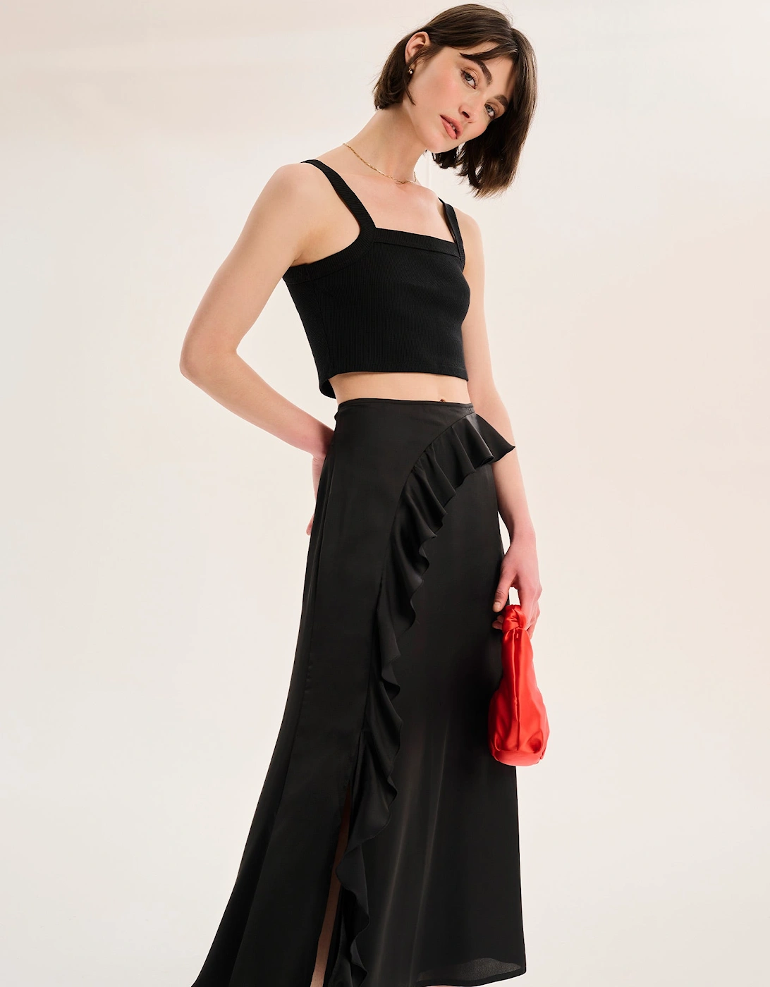 Udita Ruffle Detail Midi Satin Skirt in Black