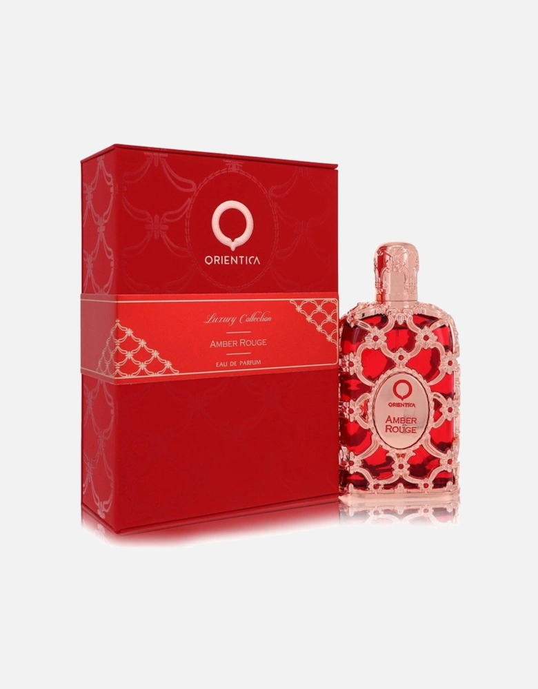 Amber Rouge by Eau De Parfum Spray (Unisex) 2.7 oz for Men - Red