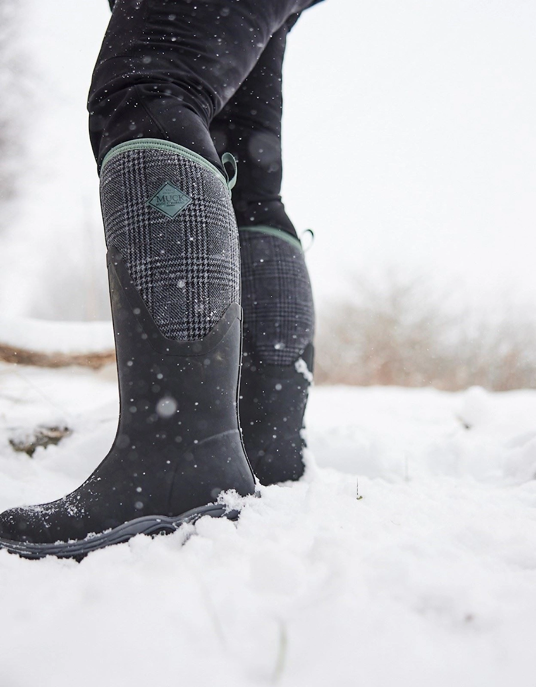 Muck Boots model MB Arctic Sport II Tall Wellingtons Female in Black/Plaid