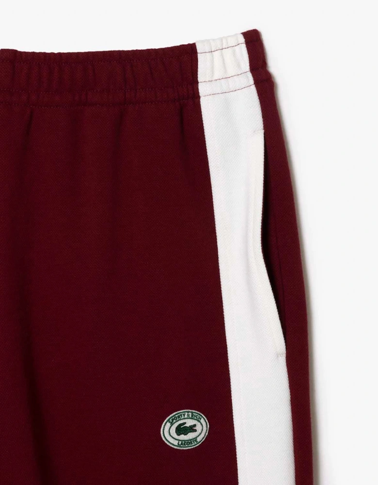 Sporty & Rich Stretch Track Pants