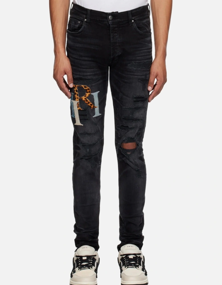 Leather Staggered Logo Ripped Jeans in Black