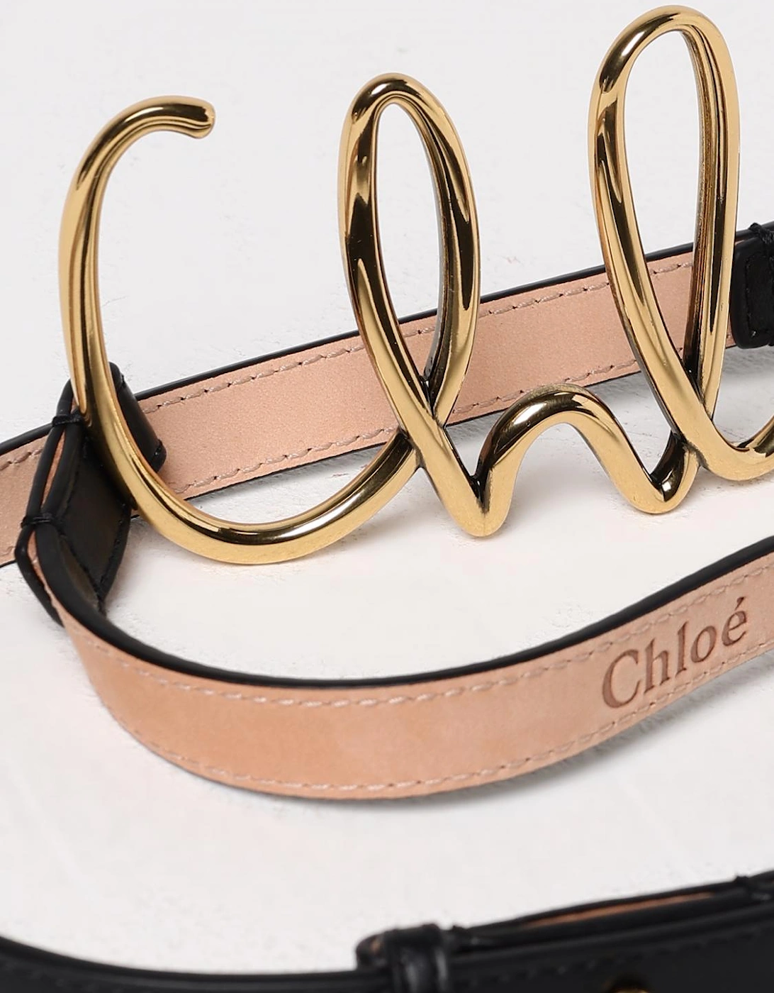 Refined Leather Belt with Metal Logo Accent Stylish Accessory for Outfit
