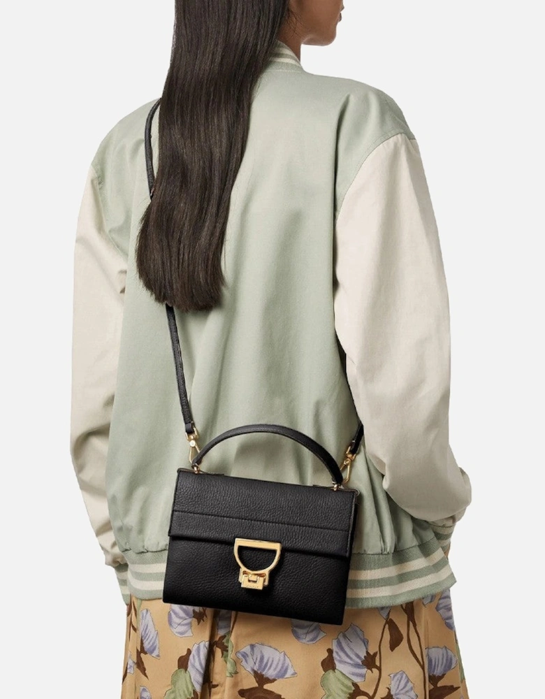 Leather Handbag with Adjustable Strap and Metallic Fastening