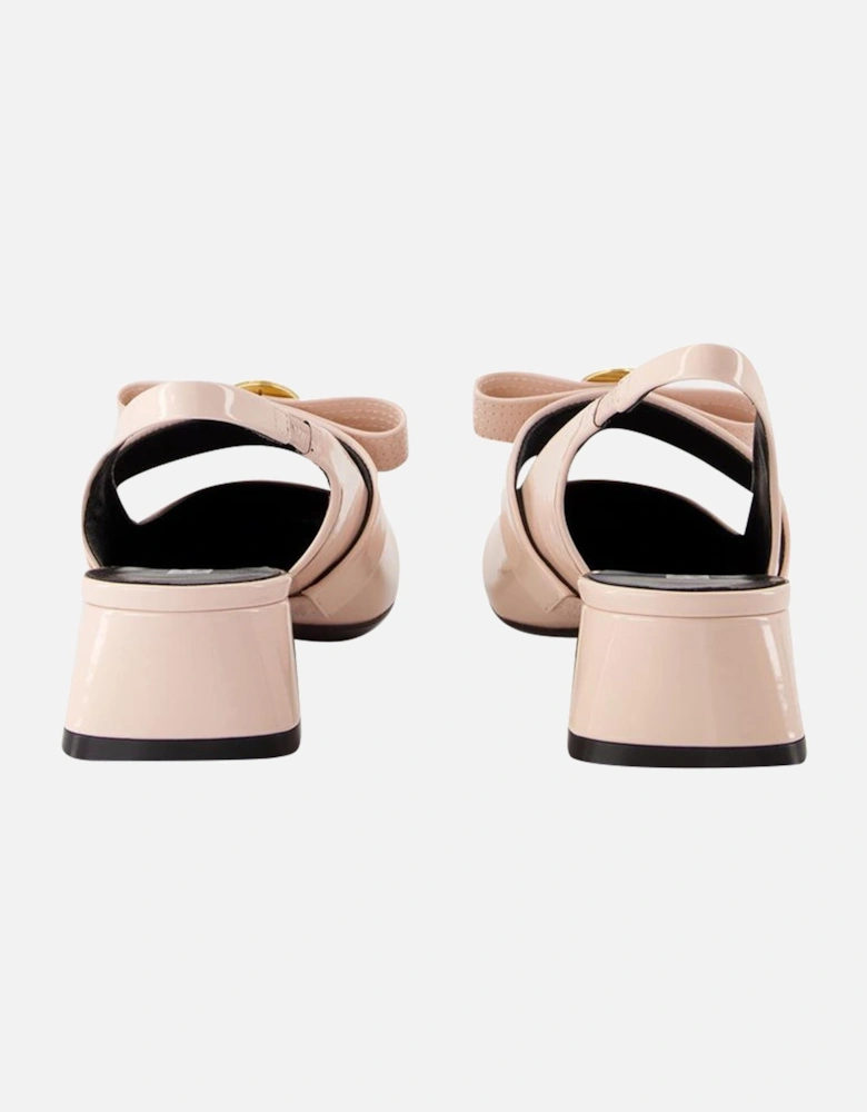 Medusa Buckle Slingback Pumps