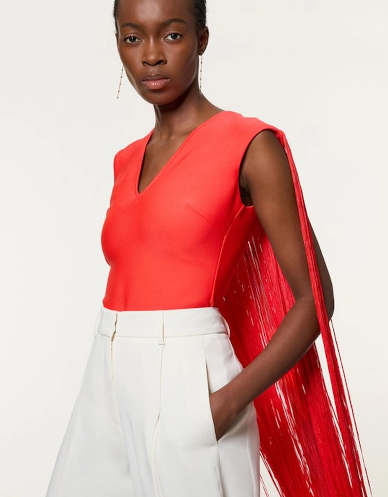 Figure Form Bandage Knit Long Tassel Cape Top