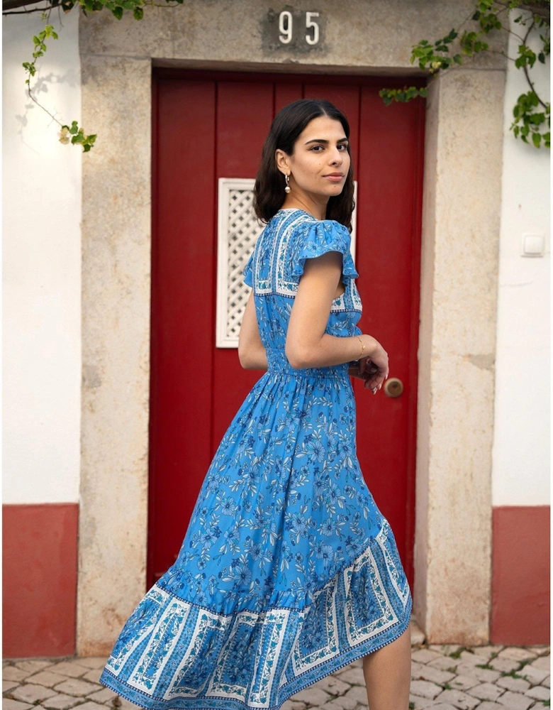 Blue Ditsy Print Sun Dress With Cross Over Back Tie Front And Dip Hem