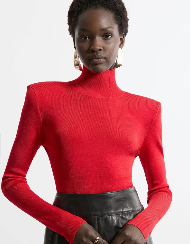 Slinky Drape Knit Power Shoulder Funnel Neck Top
