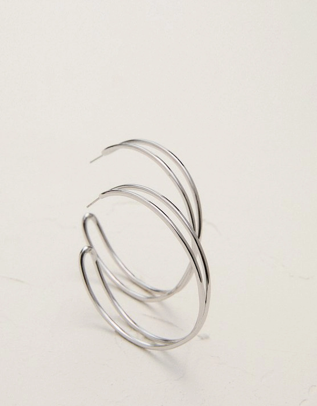Silver Tone Criss Cross Hoop Earring