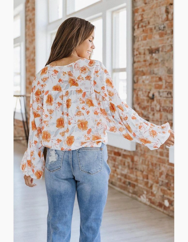 White Tassel Tie V Neck Bubble Sleeve Floral Blouse