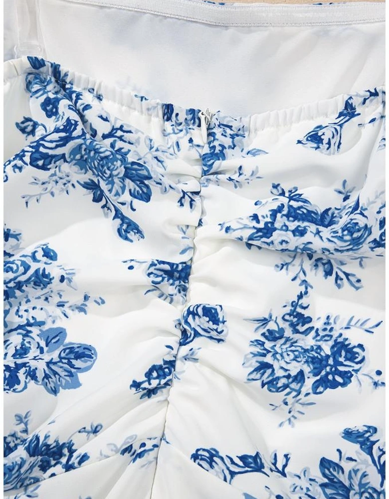 Sky Blue Floral Print Strapless Zipped Back Knot Waist Ruffled Romper