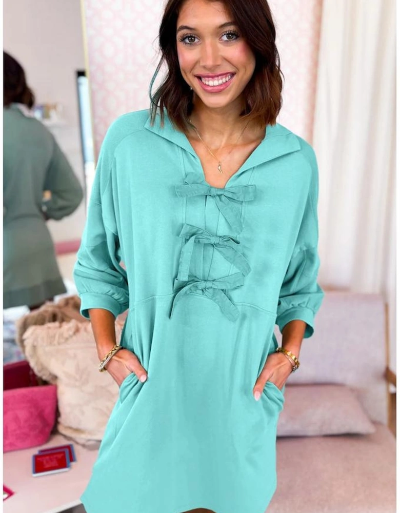 Moonlight Jade Bow Front Bracelet Sleeve Collared Side Pocket Shift Mini Dress