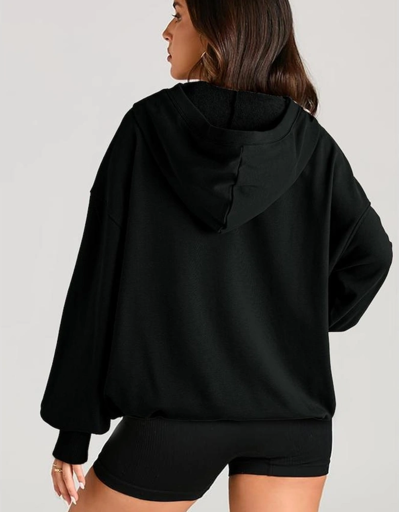 Black Solid Kangaroo Pocket Half Zipper Oversized Hoodie