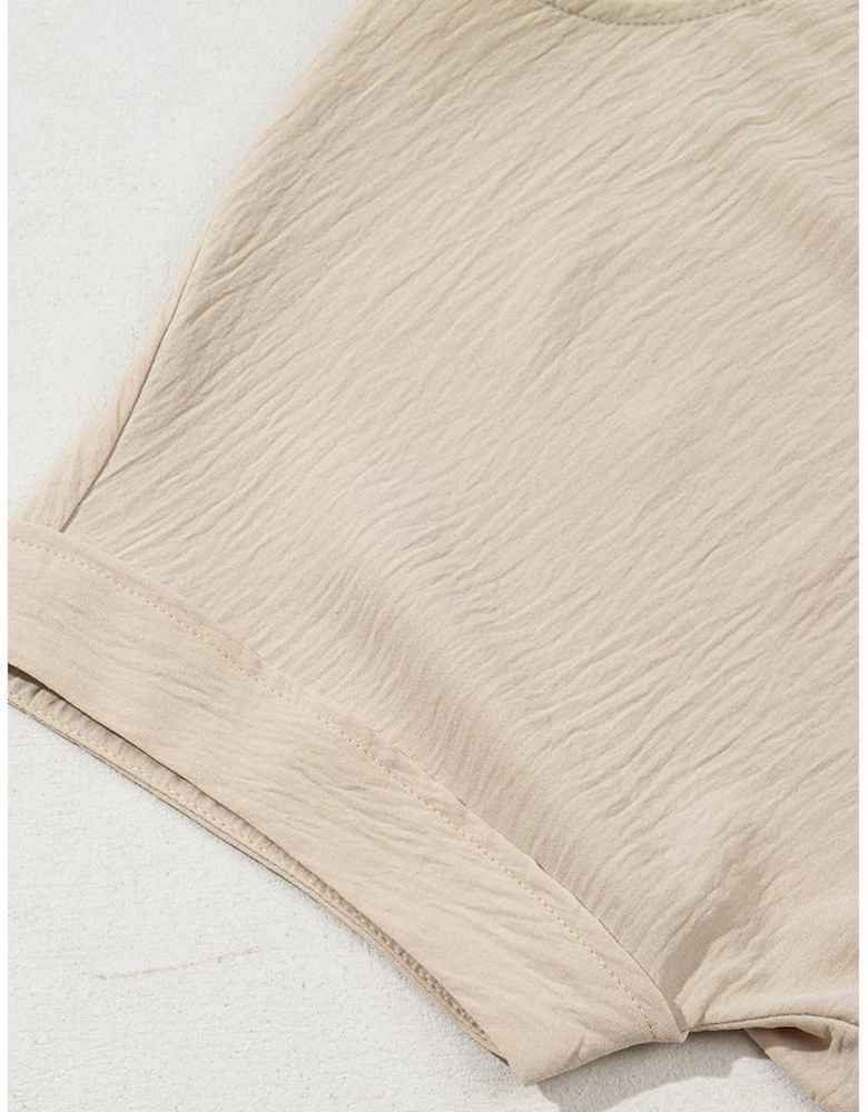 Parchment Solid Color Knotted Hem Short Sleeve Blouse