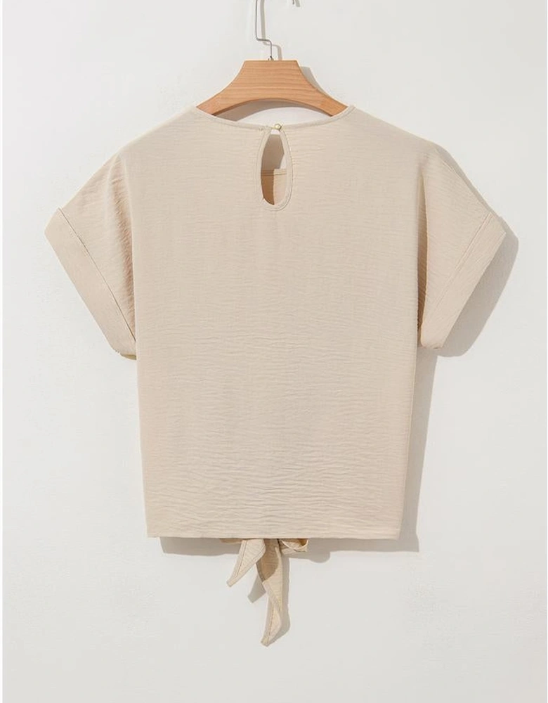 Parchment Solid Color Knotted Hem Short Sleeve Blouse