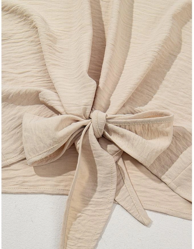 Parchment Solid Color Knotted Hem Short Sleeve Blouse