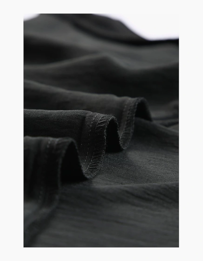 Black Smocked Wrist Shift Top