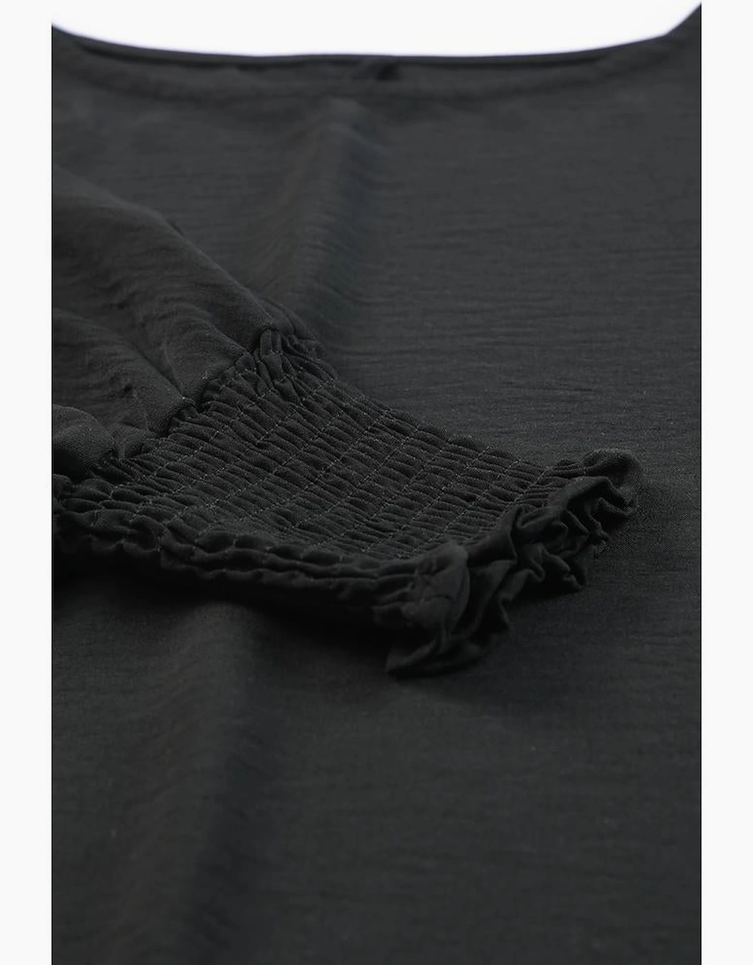 Black Smocked Wrist Shift Top