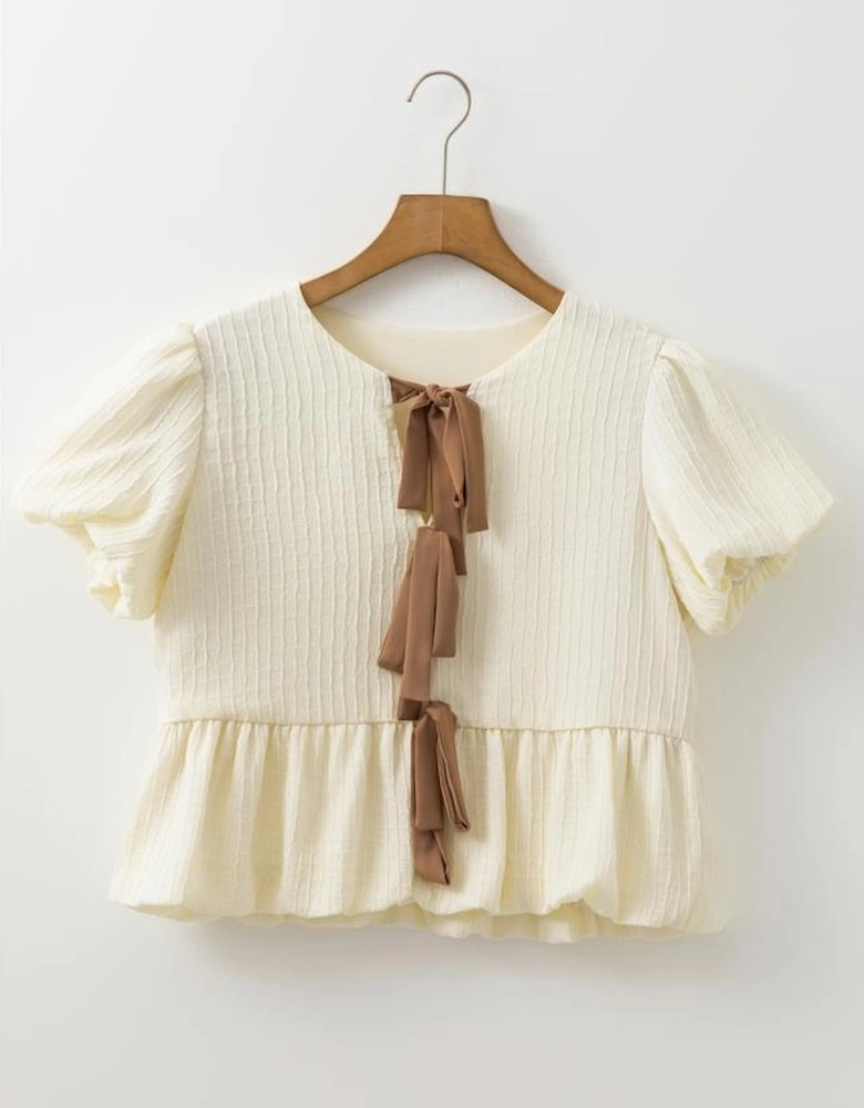 White Textured Bow Ties Front Bubble Hem Puff Short Sleeve Blouse