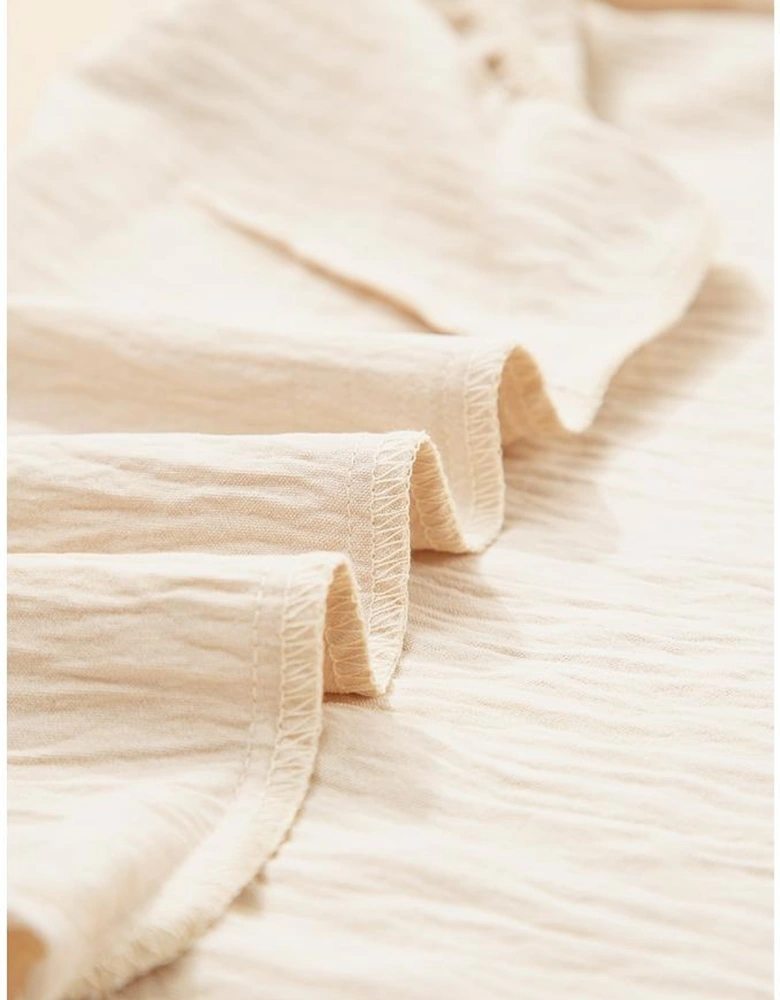 Parchment Textured Frilly Trim V Neck Sleeveless Top