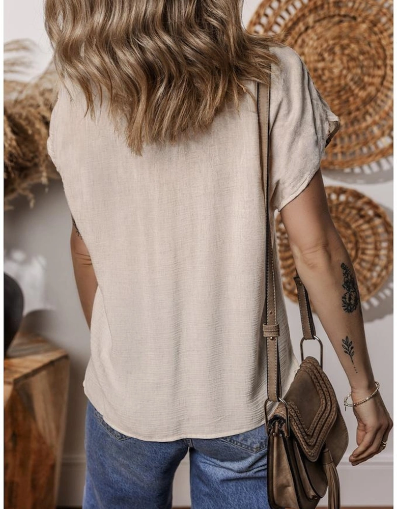 Jet Stream Geometric Embroidered Short Sleeve Tassel Tied V Neck Blouse