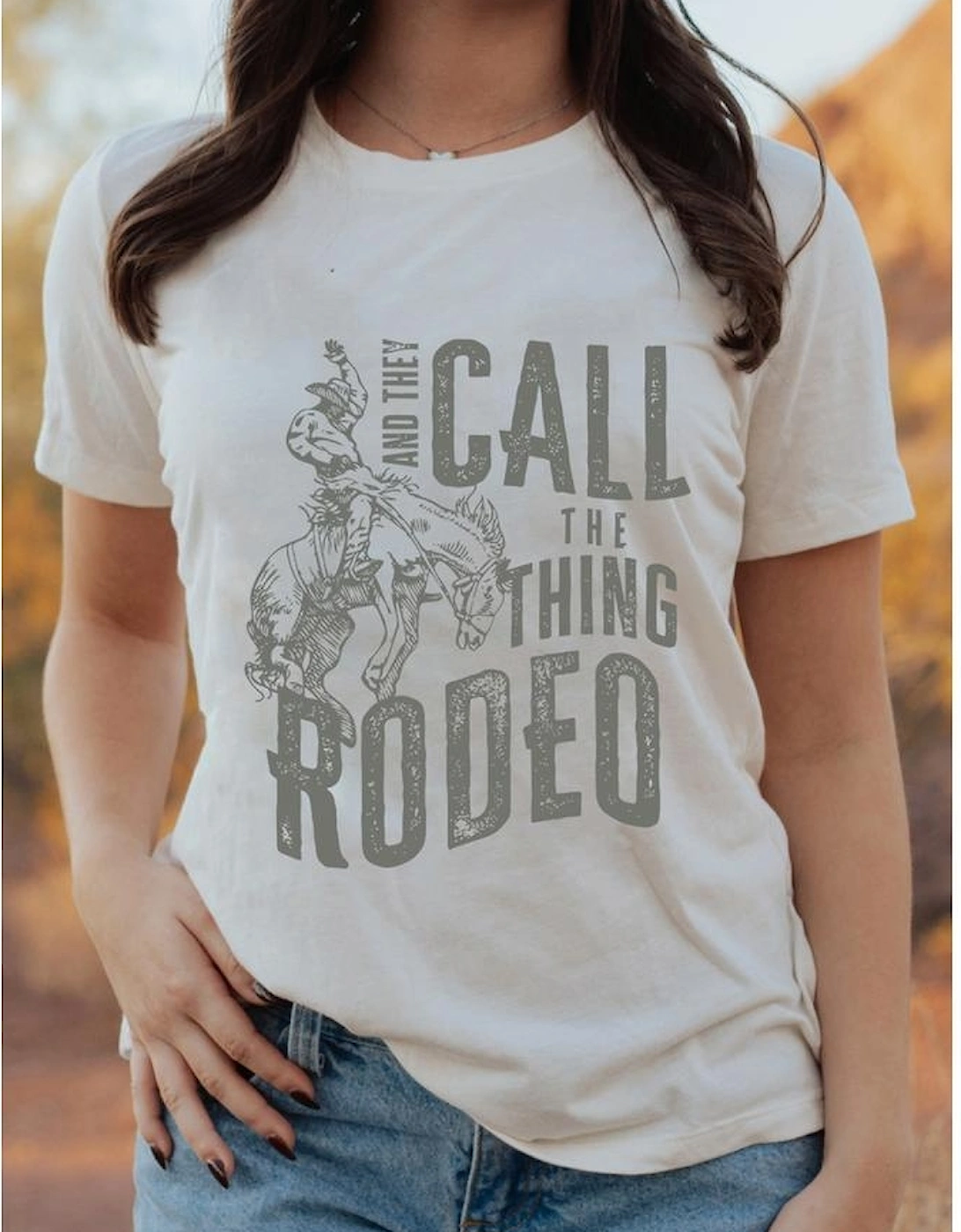 White AND THEY CALL THE THING RODEO Print Round Neck T Shirt