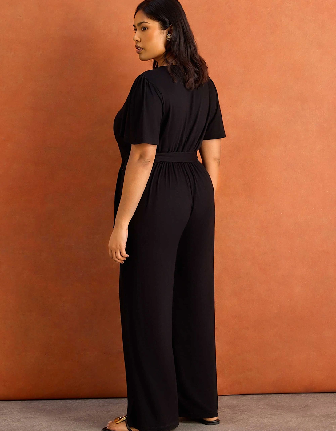 Black V Neck Wrap Flutter Sleeve Jersey Jumpsuit