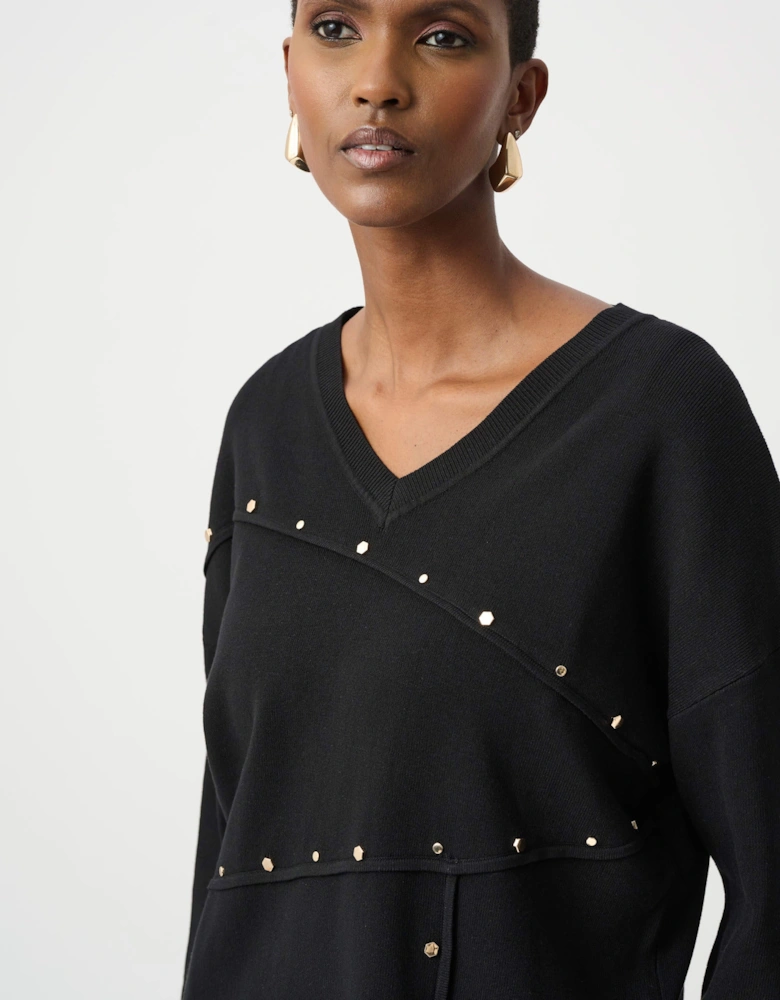 Asymmetric sweater with metal stud detail