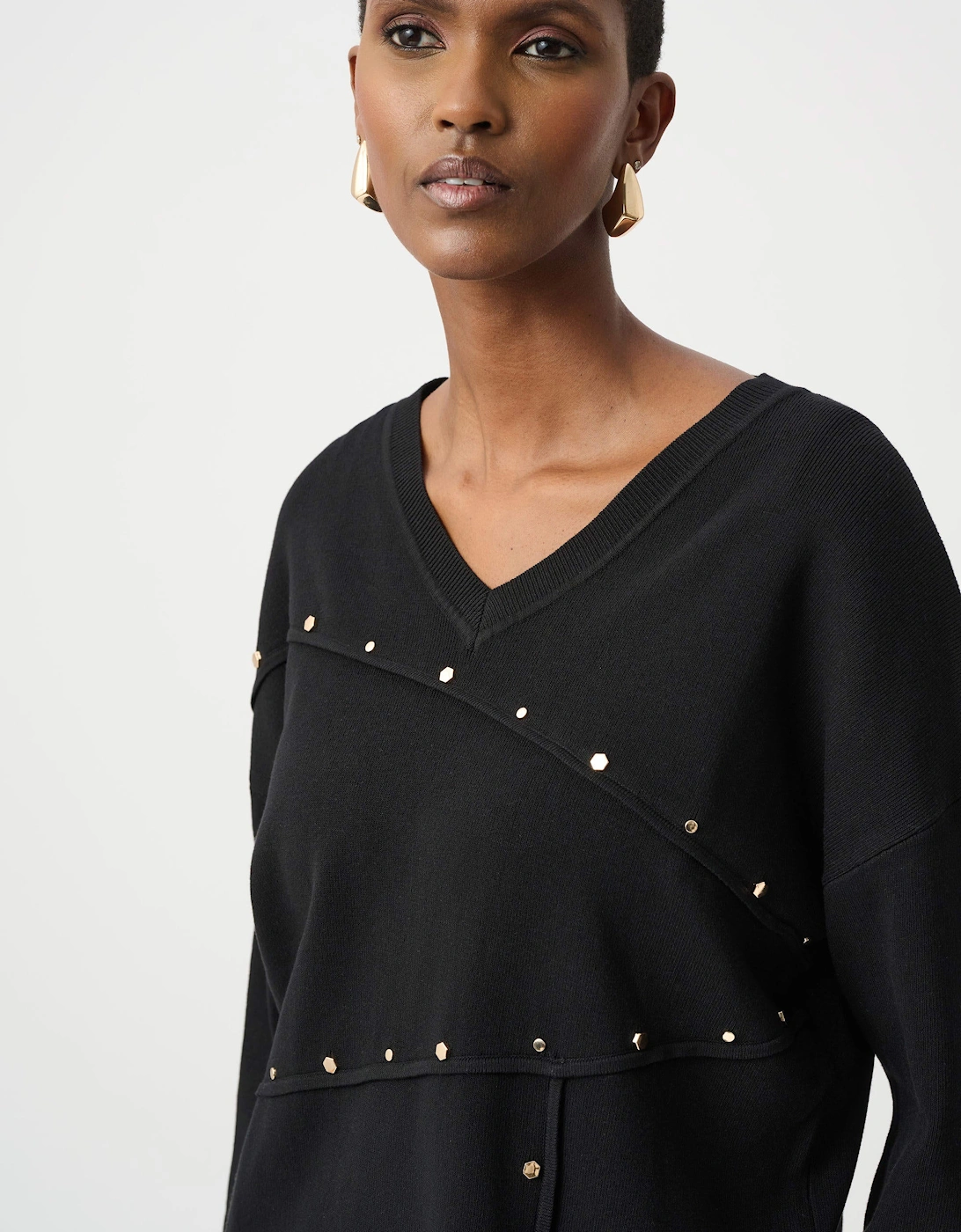 Asymmetric sweater with metal stud detail