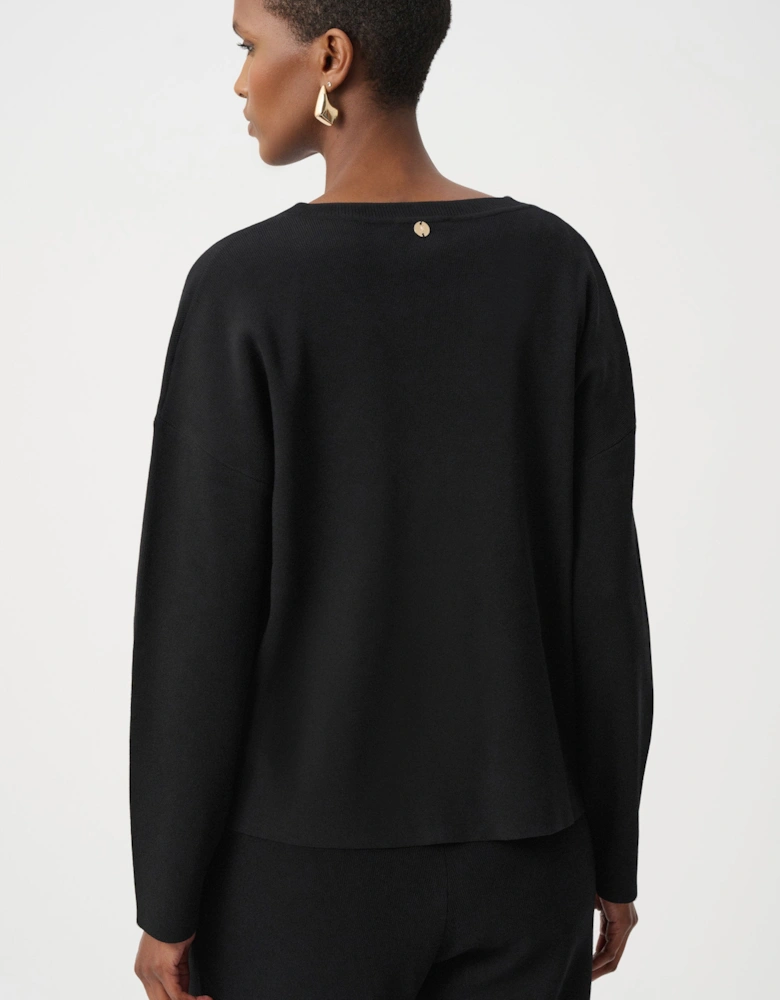 Asymmetric sweater with metal stud detail