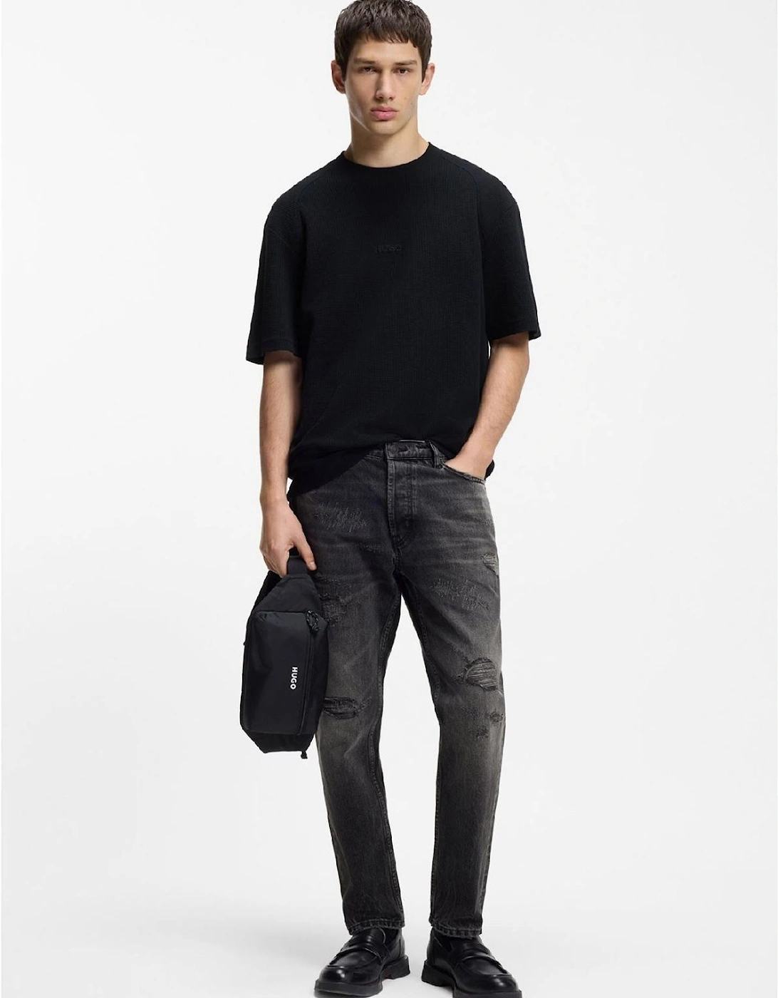 Distressed Tapered Fit Jeans