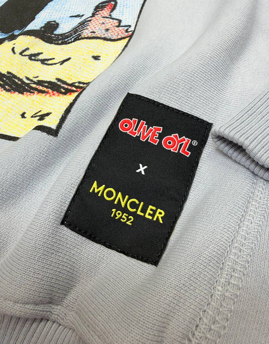 MONCLER GENIUS X OLIVE OYL OVERSIZED GRAPHIC HOODIE PALE BLUE