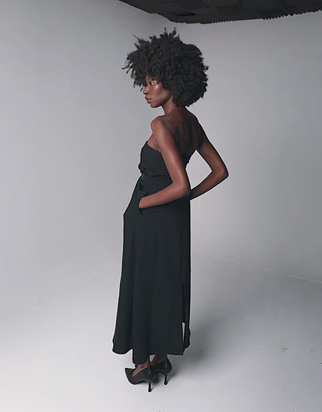 Black Strapless Dress With Asymmetrical Folds And Pearl Detail