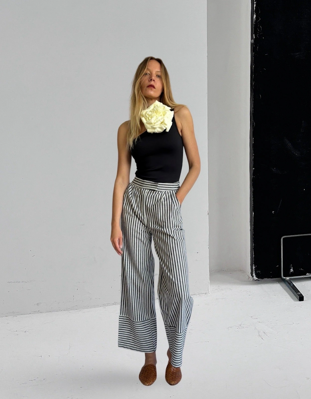 Black One Shoulder Top With White Flower Pin
