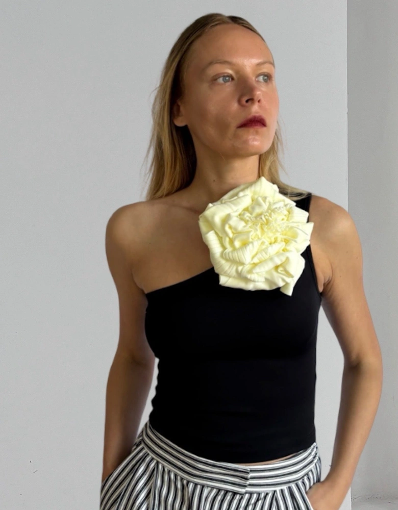 Black One Shoulder Top With White Flower Pin